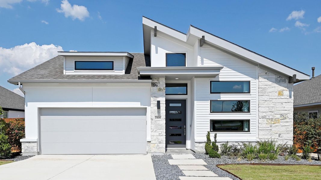 Front exterior of a new home in Veramendi 50', New Braunfels, TX, highlighting curb appeal (Image 1). Front exterior of a new home in Veramendi 50', New Braunfels, TX, highlighting curb appeal (Image 1).