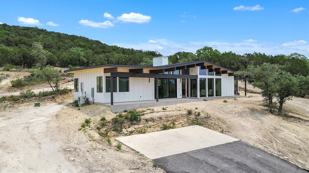 Front exterior of a new home in , Lago Vista, TX, highlighting curb appeal (Image 24). Front exterior of a new home in , Lago Vista, TX, highlighting curb appeal (Image 24).