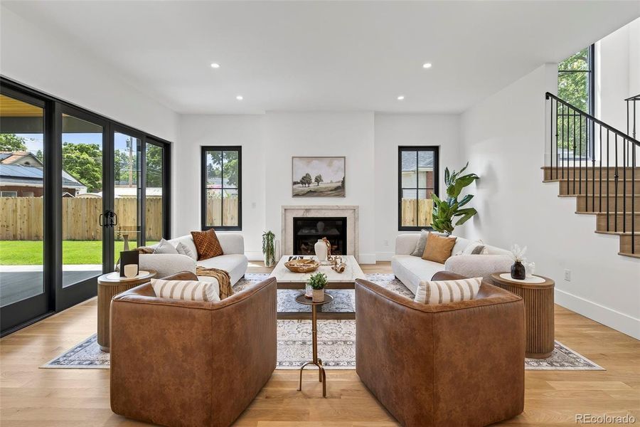 Gas fireplace and large 4 panel sliding door to covered patio