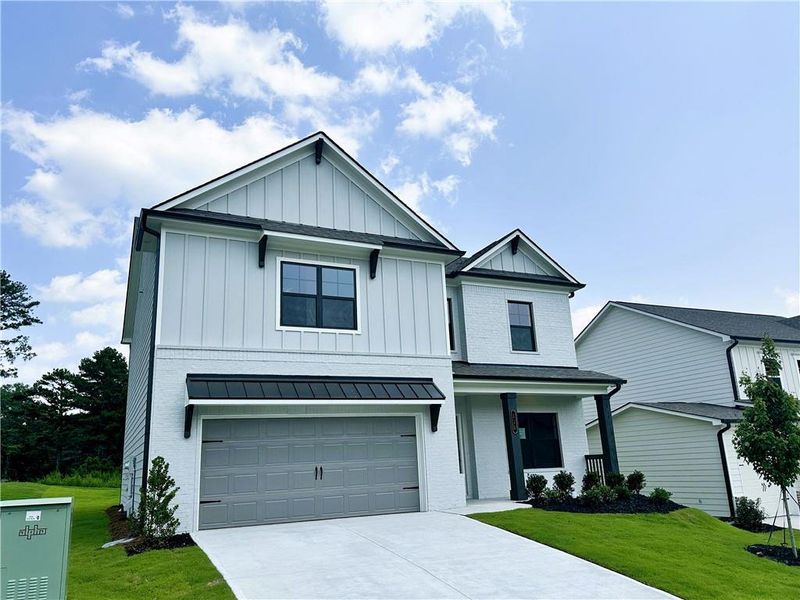 Front exterior of a new home in Summerlin, Winder, GA, highlighting curb appeal (Image 21).