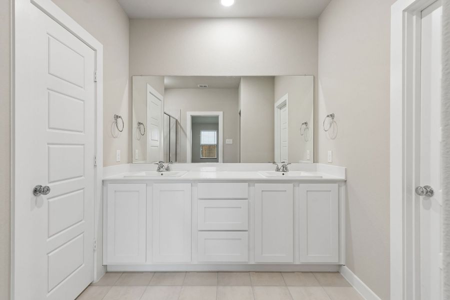 Primary Bathroom in the Emmy II home plan by Trophy Signature Homes - REPRESENTATIVE PHOTO