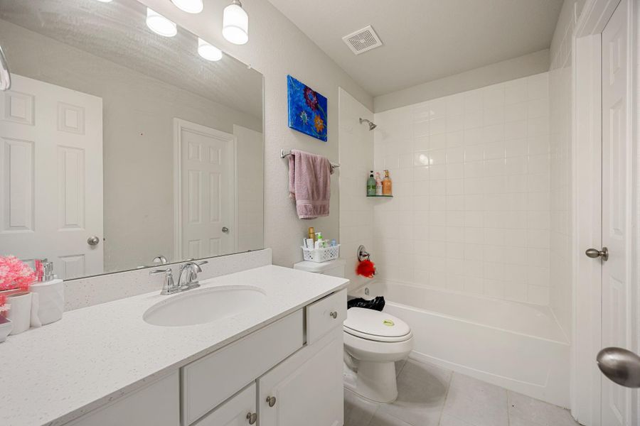 Furnished interior view inside a new home in Sunterra 60ft, Katy (Image 19).