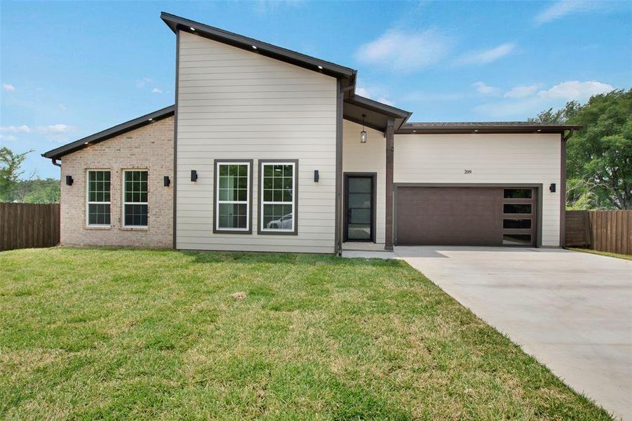 Front exterior of a new home in , Tool, TX, highlighting curb appeal (Image 1). Front exterior of a new home in , Tool, TX, highlighting curb appeal (Image 1).