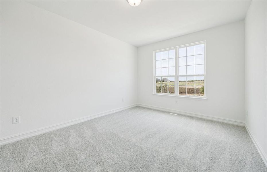 Main-level secondary bedroom providing comfort and convenience *Real home pictured Main-level secondary bedroom providing comfort and convenience *Real home pictured