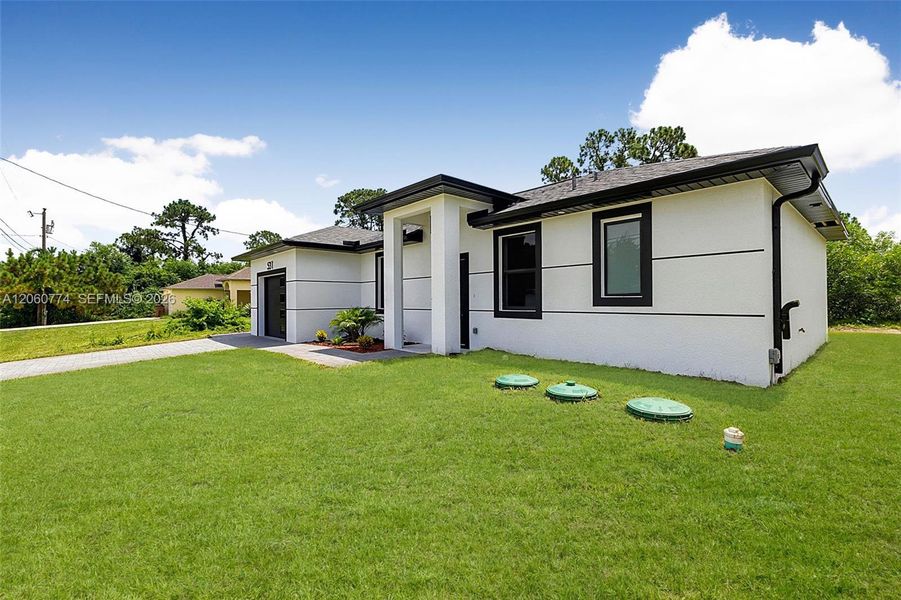 Exterior details and patio area of a home in , Lehigh Acres (Image 4). Exterior details and patio area of a home in , Lehigh Acres (Image 4).