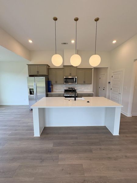 Furnished interior view inside a new home in Villages of Green Meadows, Munford (Image 7).