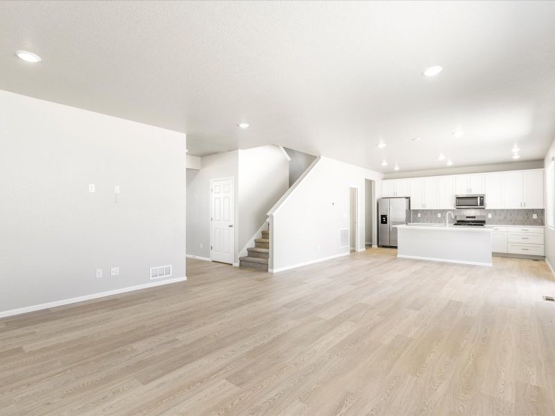 Great room in the Wateron floorplan at a Meritage Homes community in Brighton, CO.