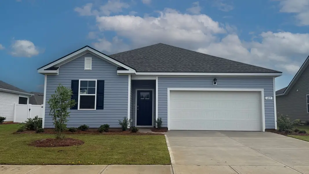 Front exterior of a new home in Eden Springs, Longs, SC, highlighting curb appeal (Image 1). Front exterior of a new home in Eden Springs, Longs, SC, highlighting curb appeal (Image 1).