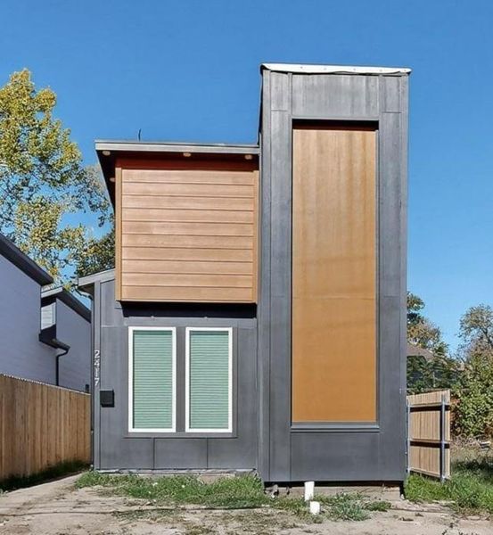 Front exterior of a new home in , Dallas, TX, highlighting curb appeal (Image 1).