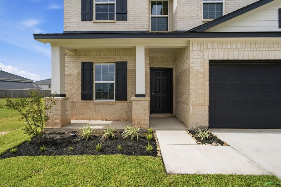 Exterior details and patio area of a home in Bluestem, Brookshire (Image 3).