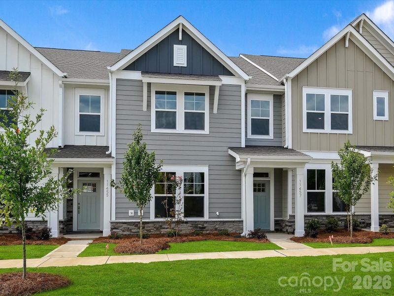 Front exterior of a new home in North Creek Village - Townhomes, Huntersville, NC, highlighting curb appeal (Image 18).