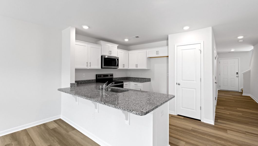 Furnished interior view inside a new home in Tanglewood Townes, Greenville (Image 4).