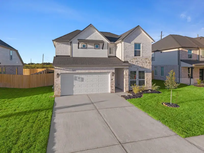 Front exterior of a new home in Briarwood Crossing, Rosenberg, TX, highlighting curb appeal (Image 1). Front exterior of a new home in Briarwood Crossing, Rosenberg, TX, highlighting curb appeal (Image 1).