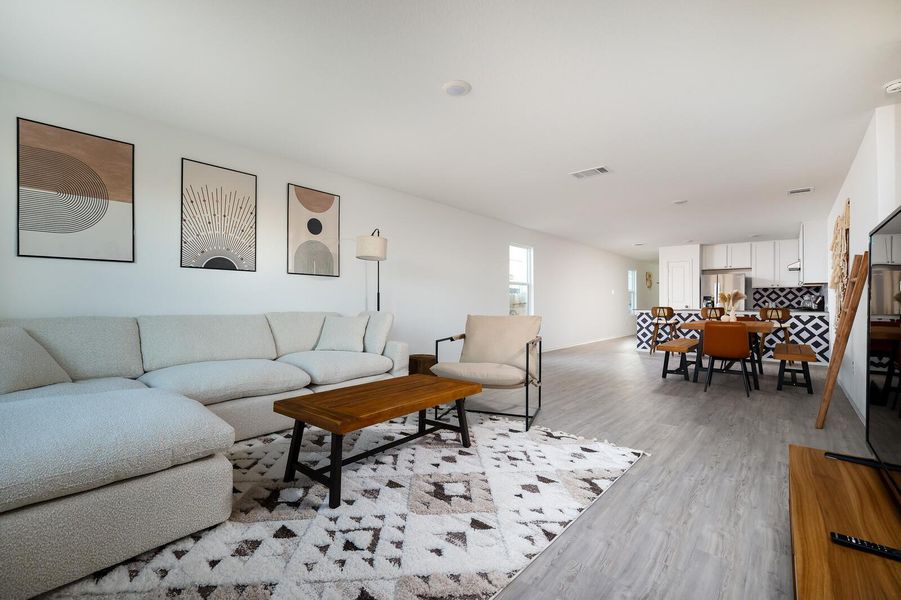 Living room featuring light wood-type flooring Living room featuring light wood-type flooring