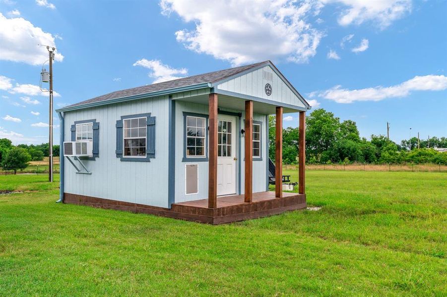 12 Foot by 20 Foot Shed that matches home with Window Unit for both cooling and heating the space.