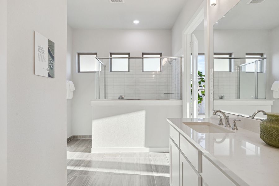 Primary Bathroom in the Monet II Home Plan by Trophy Signature Homes