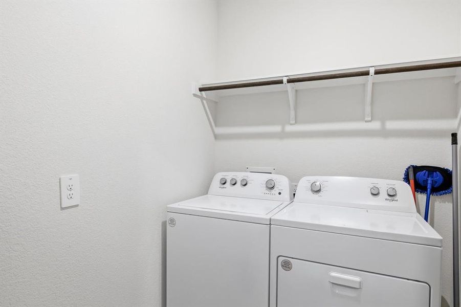 Utility room with a wall of shelves for extra storage