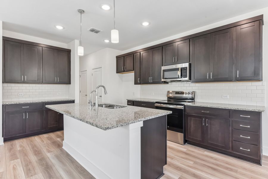 Furnished interior view inside a new home in Freedom at Anthem, Kyle (Image 4).