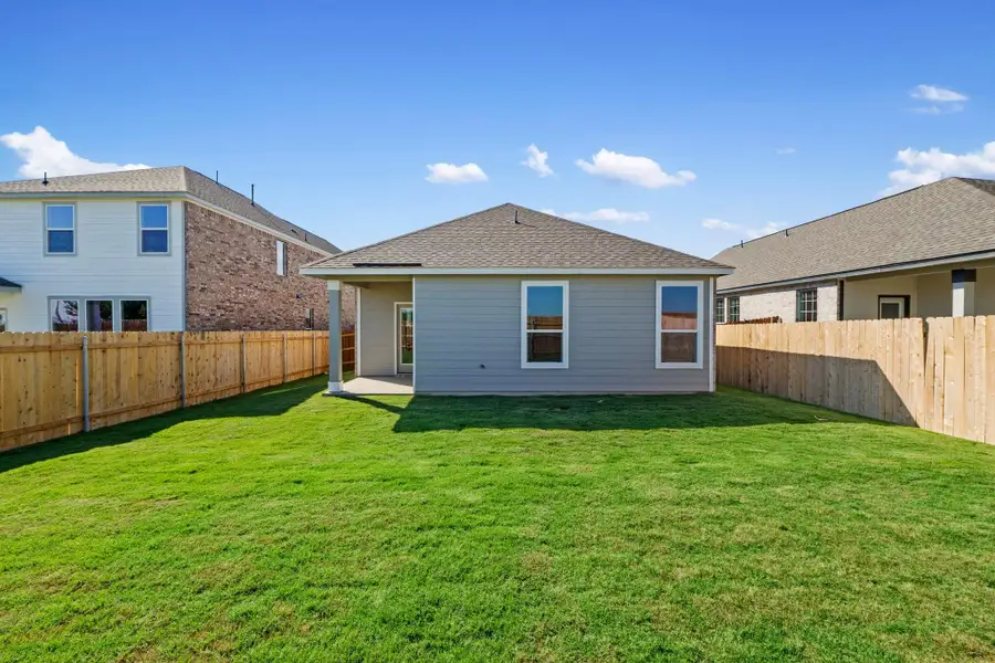 Front exterior of a new home in Salerno - Heritage Collection, Round Rock, TX, highlighting curb appeal (Image 1).