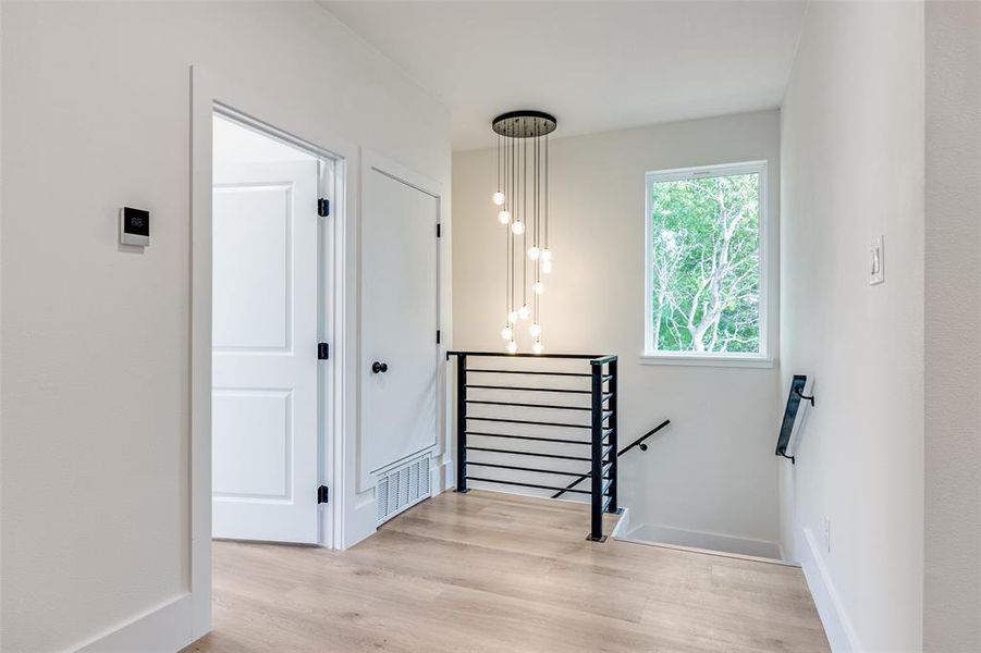 Stairway with wood finished floors and baseboards Stairway with wood finished floors and baseboards