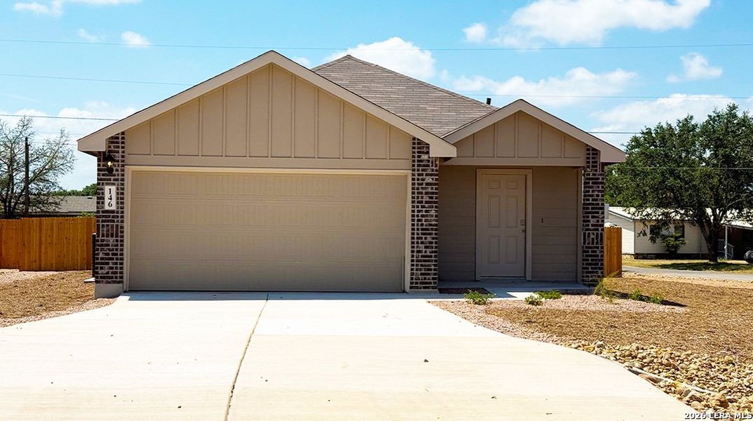 Front exterior of a new home in High Garden, Comfort, TX, highlighting curb appeal (Image 2).