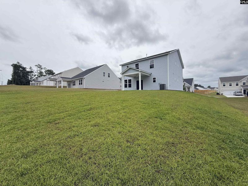 Exterior details and patio area of a home in Cottages at Roofs Pond, West Columbia (Image 27).