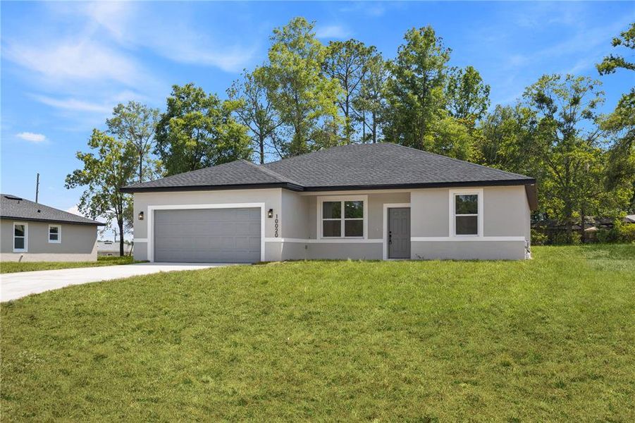 Front exterior of a new home in , Citrus Springs, FL, highlighting curb appeal (Image 2). Front exterior of a new home in , Citrus Springs, FL, highlighting curb appeal (Image 2).