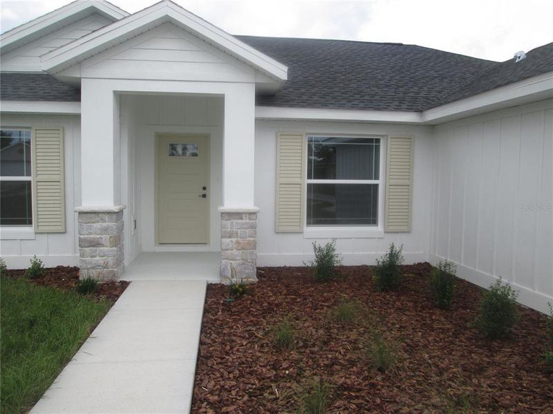 Front exterior of a new home in , Ocala, FL, highlighting curb appeal (Image 35).
