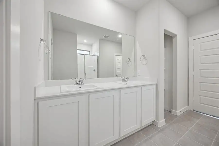 Primary Bathroom in the Oak II home plan by Trophy Signature Homes – REPRESENTATIVE PHOTO