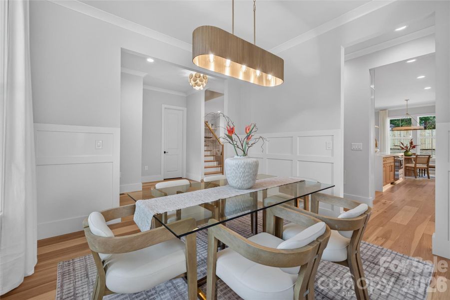 Dining Room: Wainscoting & elegant connection to kitchen via to Butler's Pantry