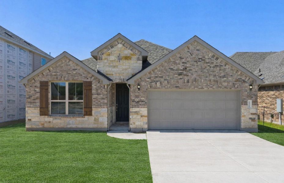Front exterior of a new home in West Cypress Hills, Spicewood, TX, highlighting curb appeal (Image 1). Front exterior of a new home in West Cypress Hills, Spicewood, TX, highlighting curb appeal (Image 1).