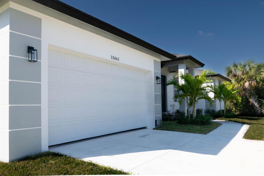 Front exterior of a new home in , Port Charlotte, FL, highlighting curb appeal (Image 24).