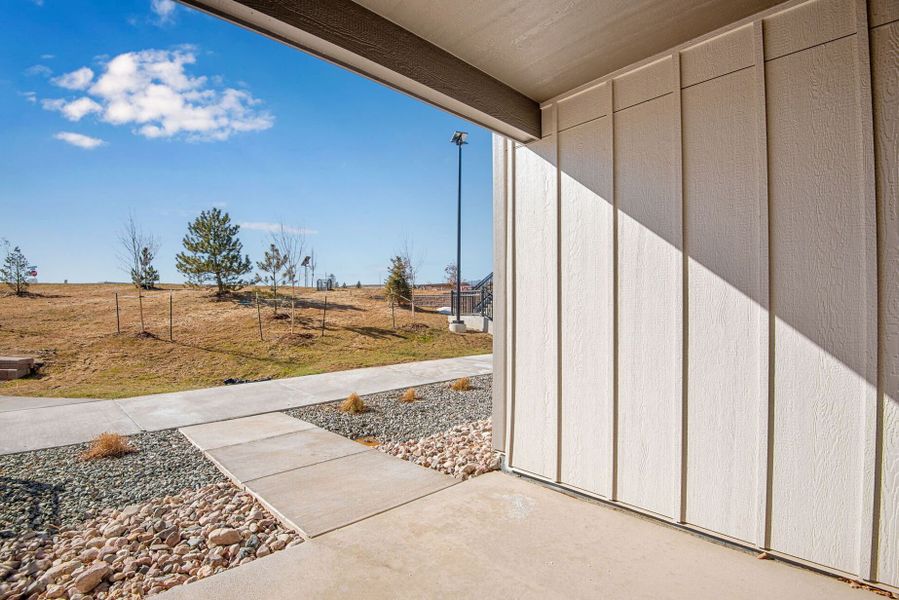Front exterior of a new home in Candelas Townhomes, Arvada, CO, highlighting curb appeal (Image 31).