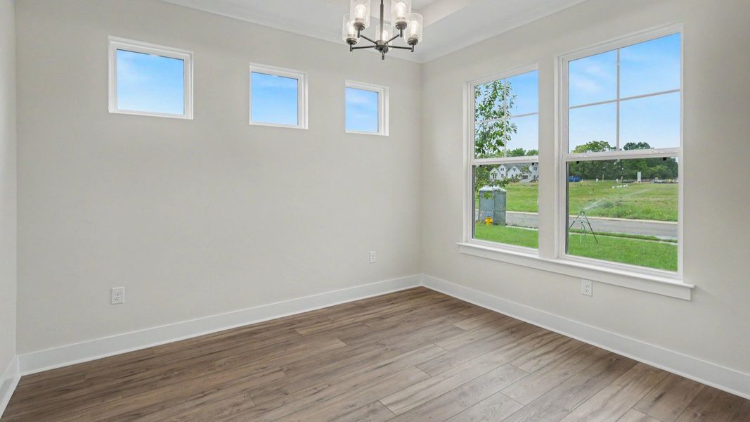 Dining area with windows and hard surface flooring
