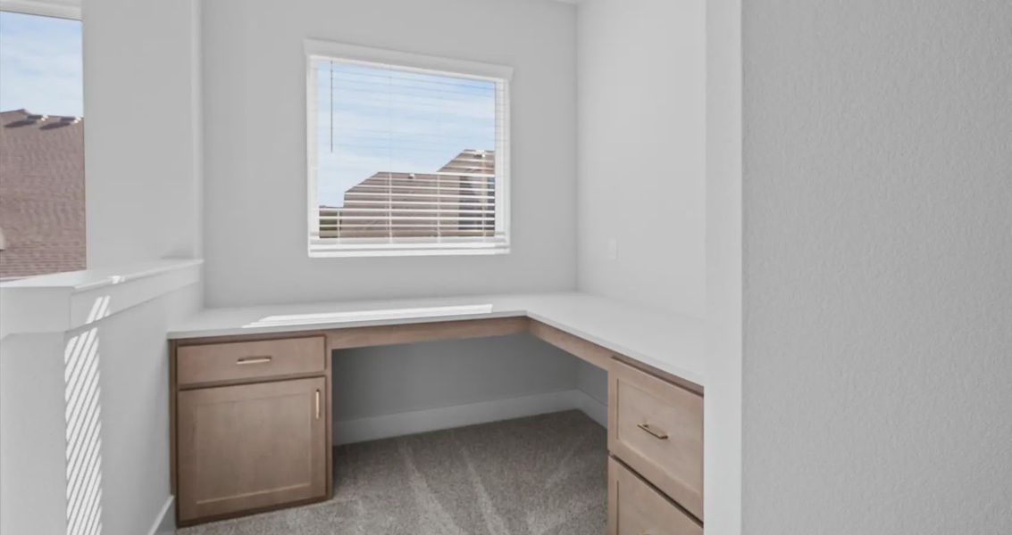 Representative furnished interior of a home built from the Raegan by Chesmar Homes in Sweetwater, Austin (Image 6).
