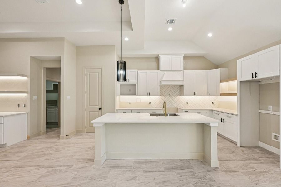 Large Kitchen Island. Ample storage and countertop space make it ideal for cooking and entertaining.