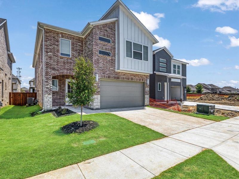 Front exterior of a new home in Royal Court, Little Elm, TX, highlighting curb appeal (Image 21).