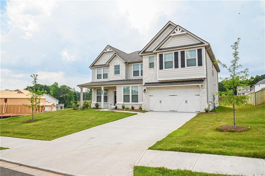 Front exterior of a new home in , Stockbridge, GA, highlighting curb appeal (Image 39).