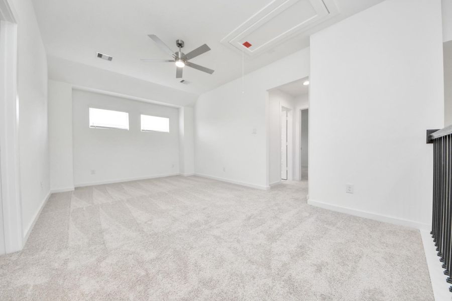 Come upstairs and enjoy a day of leisure in this fabulous game room! This is the perfect hangout spot or adult game room! Features plush carpet, high ceilings, custom paint and windows for plenty of natural light. Come upstairs and enjoy a day of leisure in this fabulous game room! This is the perfect hangout spot or adult game room! Features plush carpet, high ceilings, custom paint and windows for plenty of natural light.
