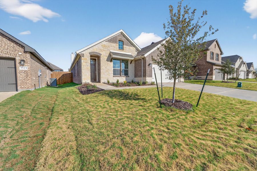 Front exterior of a new home in Liberty Pointe, Gainesville, TX, highlighting curb appeal (Image 2). Front exterior of a new home in Liberty Pointe, Gainesville, TX, highlighting curb appeal (Image 2).