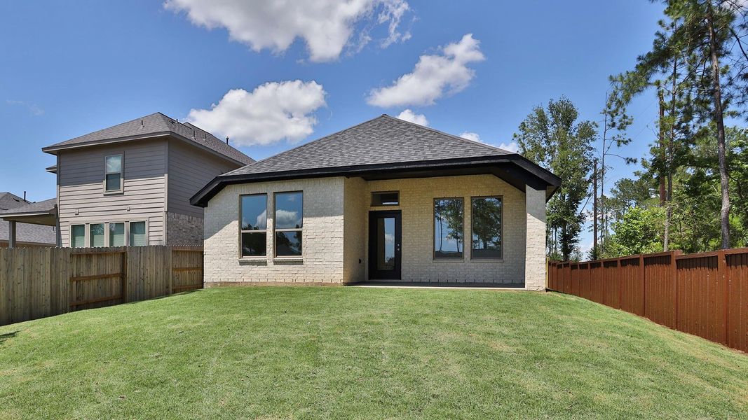 Exterior details and patio area of a home in Woodhavyn, Magnolia (Image 2).