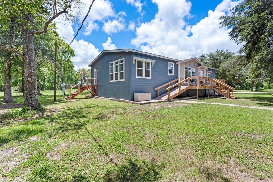 You will love these entrance options. Stairs and a ramp are available for any of your needs. It also offers a laundry entrance, and the front patio is perfect for those nights spent outside enjoying the tranquility.