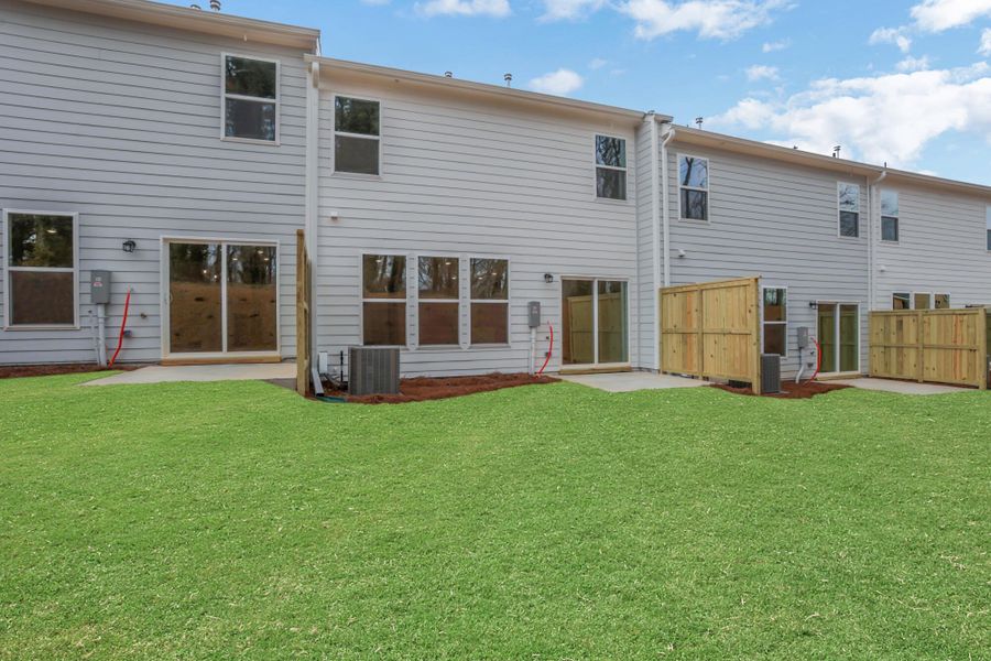 Exterior details and patio area of a home in Villas at Dawsonville Townhomes, Dawsonville (Image 26).