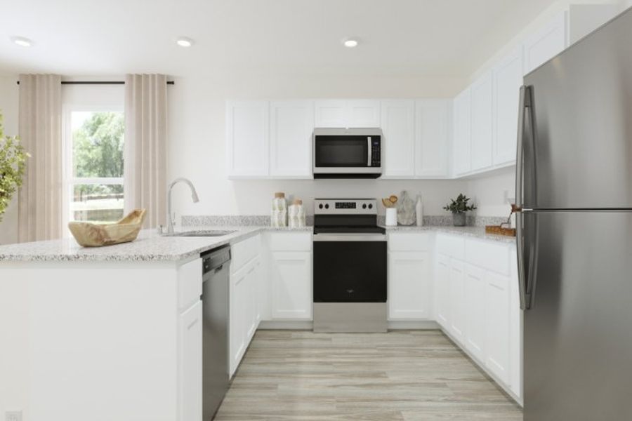 A kitchen with white cabinets. A kitchen with white cabinets.