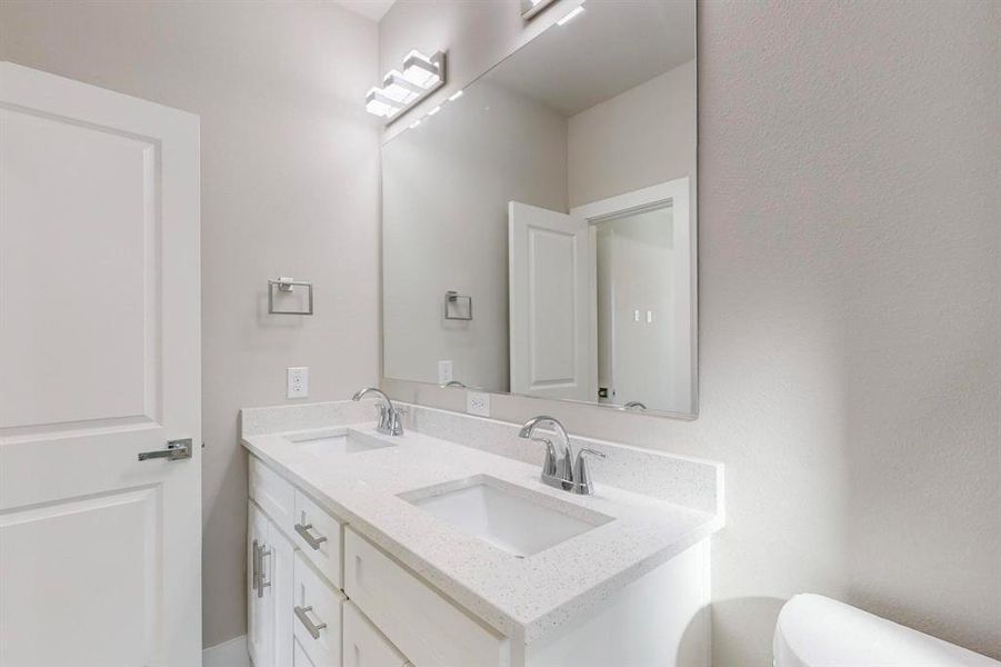 Bathroom with vanity and toilet