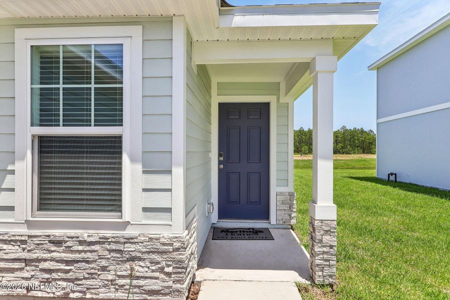 Exterior details and patio area of a home in Flagler Village - Classic Series, Palm Coast (Image 21).
