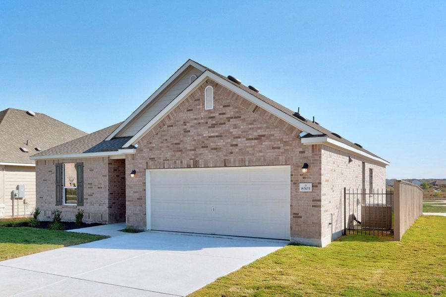 Front exterior of a new home in McKinney Crossing, Austin, TX, highlighting curb appeal (Image 1). Front exterior of a new home in McKinney Crossing, Austin, TX, highlighting curb appeal (Image 1).