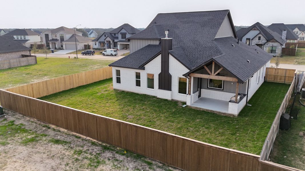 Exterior details and patio area of a home in Greens Prairie Reserve, College Station (Image 32).