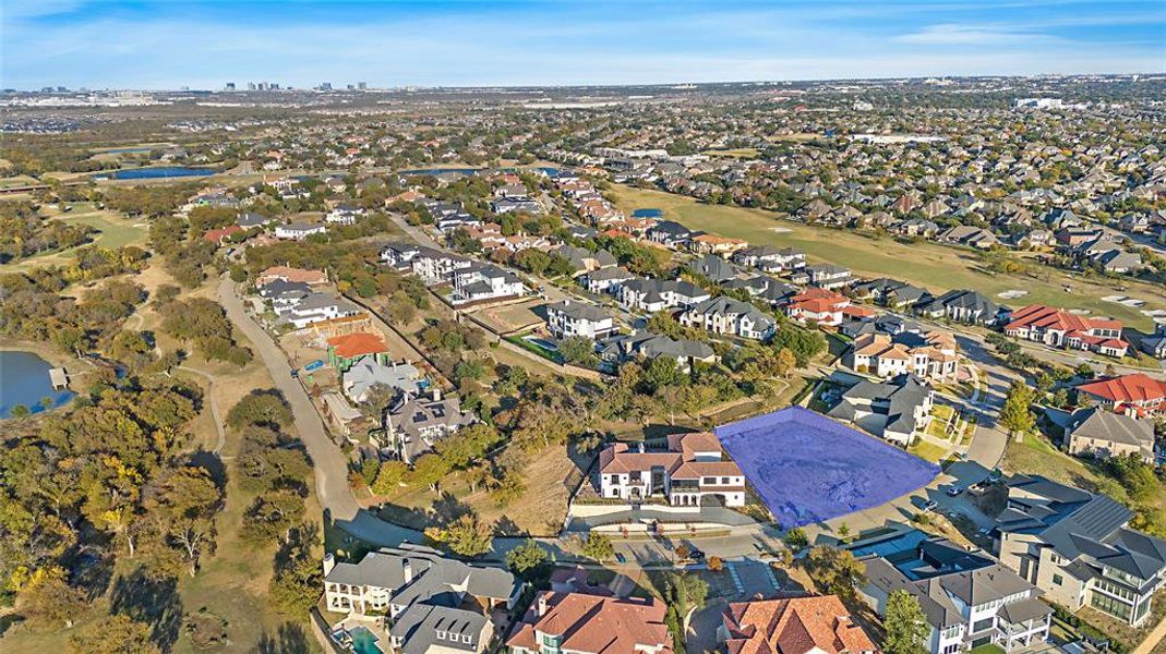 Aerial view of property's location with nearby suburban area and a golf club