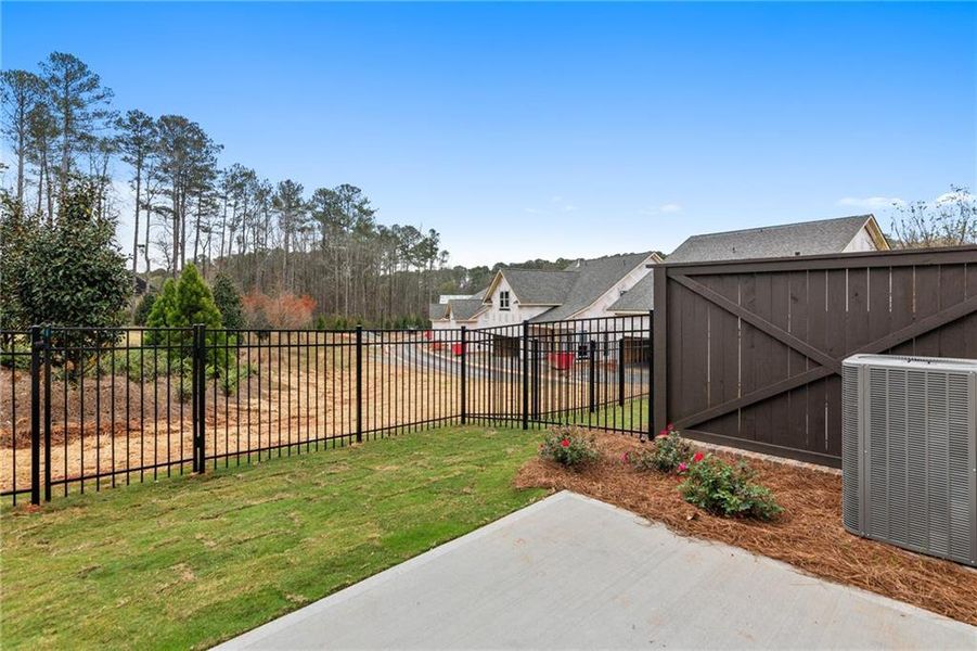 Exterior details and patio area of a home in Waterside Townhomes, Peachtree Corners (Image 4).
